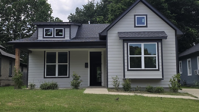 1616 Foster Ave, Memphis, TN 38106 - bungalow-style home with a shingled roof, a front lawn, and covered porch