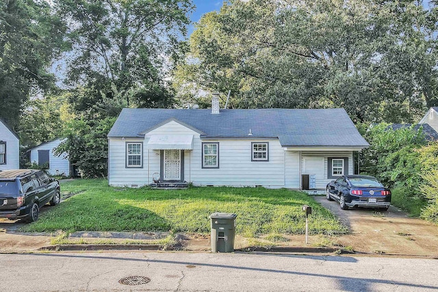 598 Orchard Ave, Memphis, TN 38127 - view of front of property with a front yard, entry steps, and a chimney