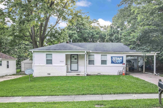 3553 Randolph St, Memphis, TN 38127 - view of front of property featuring crawl space, a front yard, brick siding, and an attached carport