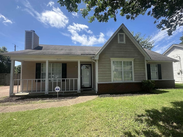 7029 Petten Cv, Memphis, TN 38133 - view of front of property featuring covered porch, a chimney, and brick siding
