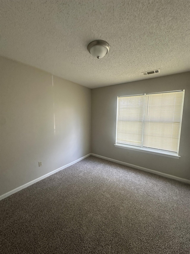 7029 Petten Cv, Memphis, TN 38133 - carpeted empty room featuring a textured ceiling and baseboards
