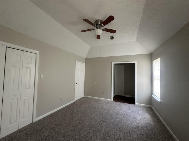 7029 Petten Cv, Memphis, TN 38133 - unfurnished bedroom with dark carpet, a textured ceiling, and a ceiling fan