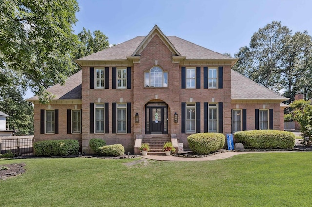 927 Oakmont Ridge Cv, Collierville, TN 38017 - colonial house featuring brick siding and a shingled roof