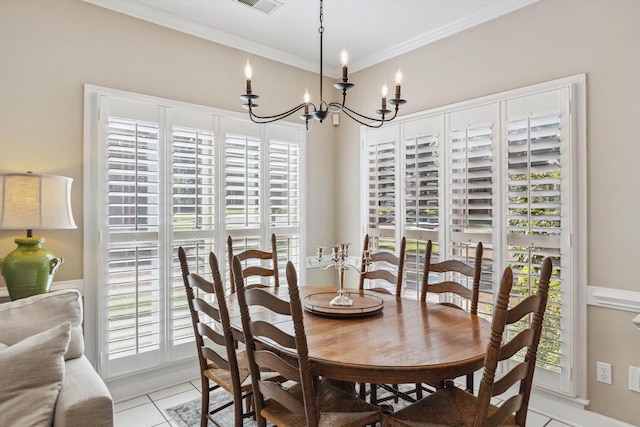 927 Oakmont Ridge Cv, Collierville, TN 38017 - dining area featuring a chandelier, light tile patterned floors, and ornamental molding