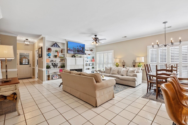 927 Oakmont Ridge Cv, Collierville, TN 38017 - living room featuring a chandelier, light tile patterned flooring, a ceiling fan, ornamental molding, and built in features