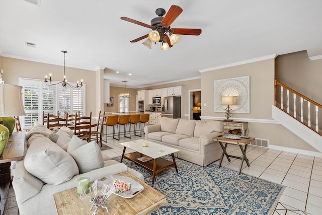 927 Oakmont Ridge Cv, Collierville, TN 38017 - living room featuring light tile patterned flooring, ornamental molding, a chandelier, stairs, and a ceiling fan