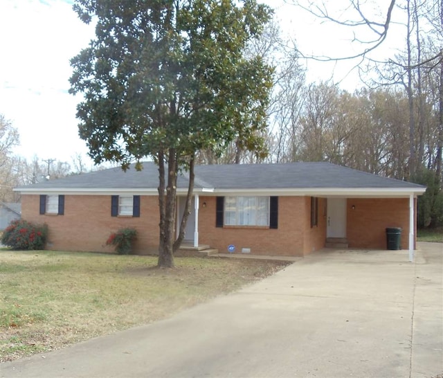 273 Main St, Ripley, TN 38063 - single story home featuring brick siding, driveway, an attached carport, and a front yard