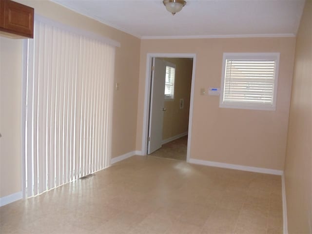 273 Main St, Ripley, TN 38063 - empty room featuring ornamental molding and baseboards