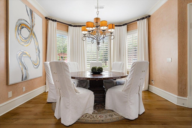 269 N Monterey Farms Cv, Collierville, TN 38017 - dining area featuring a chandelier and wood finished floors