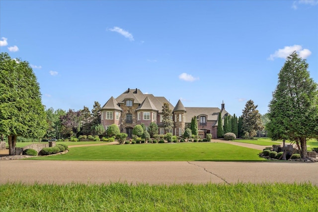 269 N Monterey Farms Cv, Collierville, TN 38017 - french provincial home featuring a front yard and stone siding