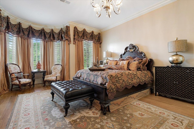 269 N Monterey Farms Cv, Collierville, TN 38017 - bedroom featuring a chandelier, crown molding, and wood finished floors
