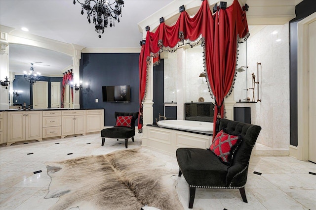 269 N Monterey Farms Cv, Collierville, TN 38017 - bathroom with a chandelier, a garden tub, vanity, marble tiled flooring, and decorative columns
