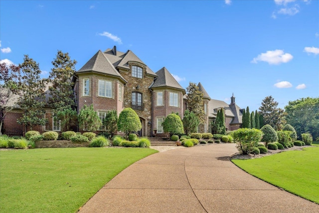 269 N Monterey Farms Cv, Collierville, TN 38017 - view of front facade featuring a front yard and brick siding