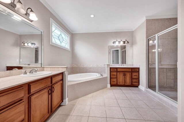 1062 Center Ridge Rd, Collierville, TN 38017 - bathroom with two vanities, a stall shower, a garden tub, tile patterned flooring, and crown molding