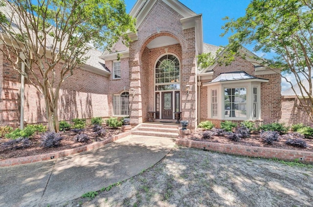 1062 Center Ridge Rd, Collierville, TN 38017 - property entrance featuring brick siding and a shingled roof