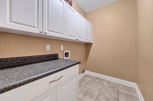 1062 Center Ridge Rd, Collierville, TN 38017 - laundry area featuring cabinet space, washer hookup, and light tile patterned floors