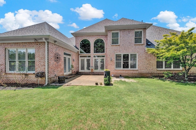 1062 Center Ridge Rd, Collierville, TN 38017 - back of property with brick siding, a shingled roof, a patio, a yard, and french doors