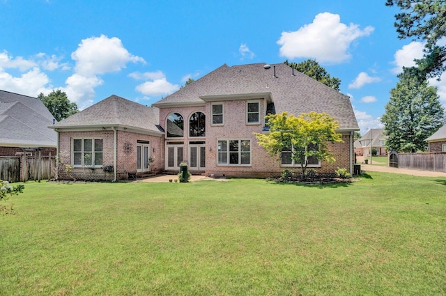 1062 Center Ridge Rd, Collierville, TN 38017 - back of property with brick siding, a patio area, and a shingled roof