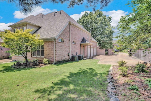 1062 Center Ridge Rd, Collierville, TN 38017 - view of property exterior with brick siding, an attached garage, a shingled roof, and driveway