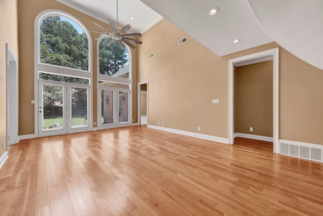 1062 Center Ridge Rd, Collierville, TN 38017 - unfurnished living room with ceiling fan, healthy amount of natural light, light wood-style floors, crown molding, and a high ceiling