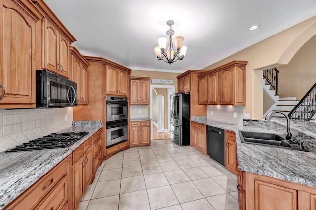 1062 Center Ridge Rd, Collierville, TN 38017 - kitchen with black appliances, a chandelier, tasteful backsplash, crown molding, and light tile patterned floors