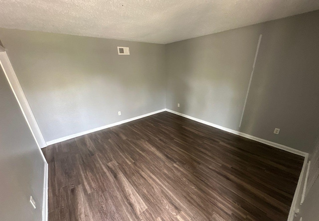 3430 Dobbin Ferry Ave, Memphis, TN 38118 - spare room featuring dark wood-style floors and a textured ceiling