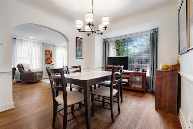 149 Palisade St, Memphis, TN 38111 - dining room featuring arched walkways, crown molding, wood finished floors, and a chandelier