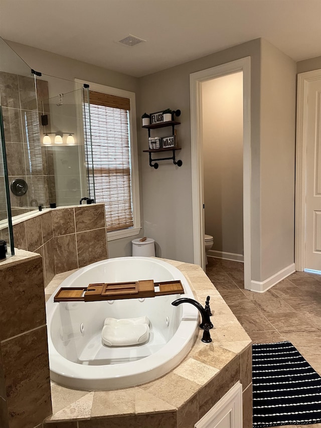 8334 Stonecrest Dr W, Olive Branch, MS 38654 - full bathroom with a jetted tub and a tile shower