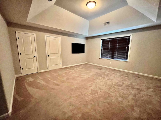 8334 Stonecrest Dr W, Olive Branch, MS 38654 - unfurnished bedroom with a raised ceiling and carpet