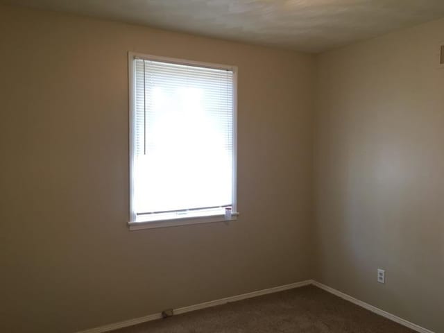 3092 Knightway St, Memphis, TN 38118 - spare room featuring dark colored carpet