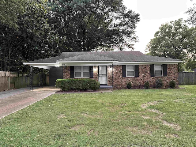 1289 Heathcliff Dr, Memphis, TN 38134 - ranch-style house with driveway, an attached carport, a shingled roof, and brick siding