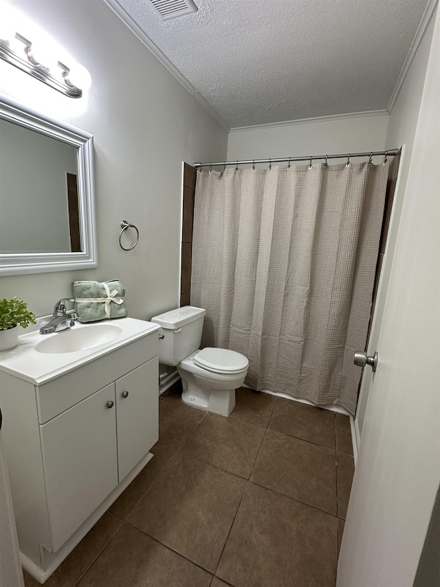1289 Heathcliff Dr, Memphis, TN 38134 - full bathroom with a textured ceiling, vanity, ornamental molding, and tile patterned flooring
