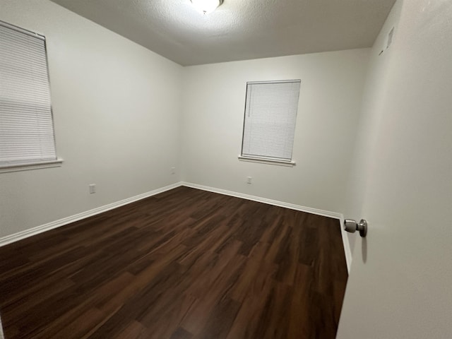 1289 Heathcliff Dr, Memphis, TN 38134 - empty room with dark wood finished floors and baseboards