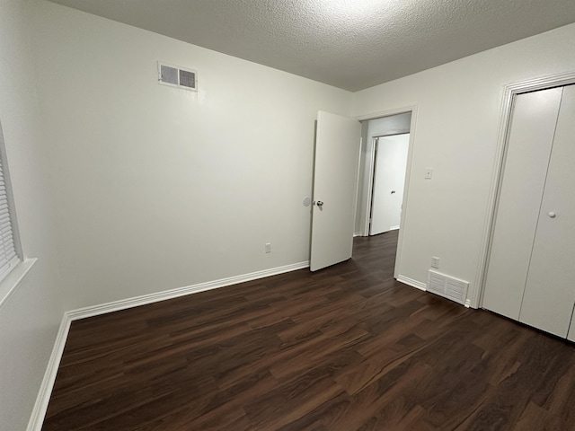 1289 Heathcliff Dr, Memphis, TN 38134 - unfurnished bedroom featuring dark wood-style floors and baseboards