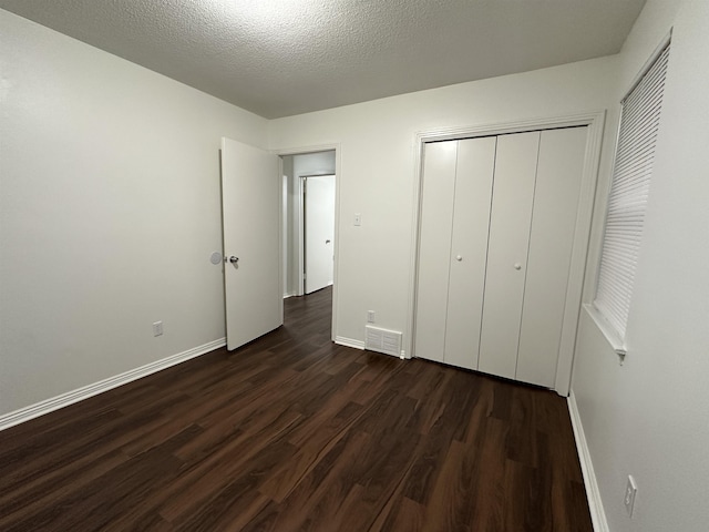 1289 Heathcliff Dr, Memphis, TN 38134 - unfurnished bedroom featuring dark wood-type flooring and a closet
