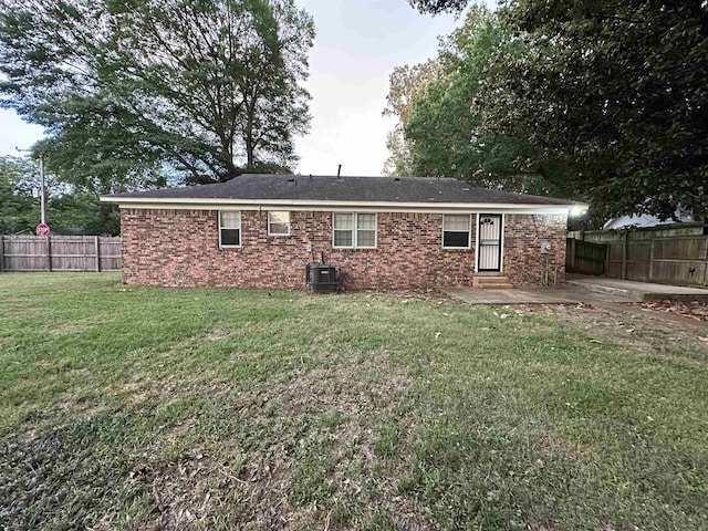 1289 Heathcliff Dr, Memphis, TN 38134 - back of house featuring a patio area, a fenced backyard, and brick siding