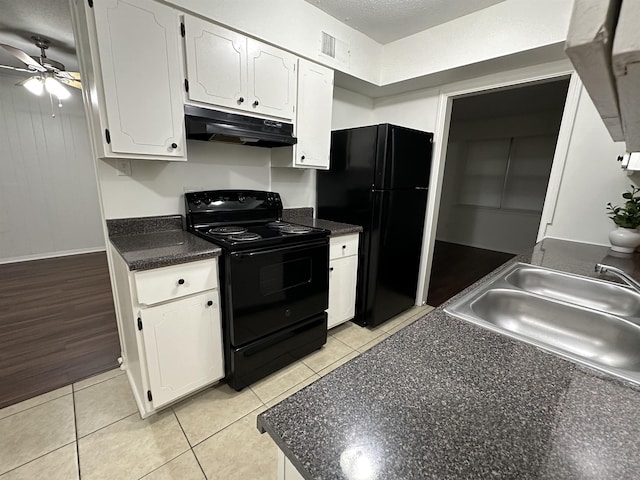 1289 Heathcliff Dr, Memphis, TN 38134 - kitchen featuring black appliances, under cabinet range hood, ceiling fan, dark countertops, and white cabinets