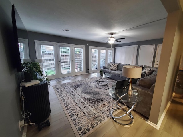 6615 Poplar Ave Unit 1, Germantown, TN 38138 - living area featuring plenty of natural light, a ceiling fan, and wood finished floors