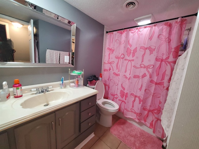 6615 Poplar Ave Unit 1, Germantown, TN 38138 - bathroom with vanity, tile patterned flooring, a shower with shower curtain, and a textured ceiling