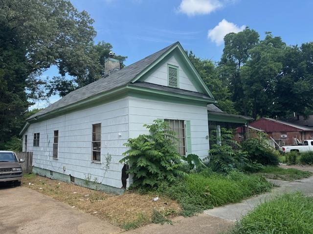 1557 Preston Ave, Memphis, TN 38106 - view of side of property featuring a chimney
