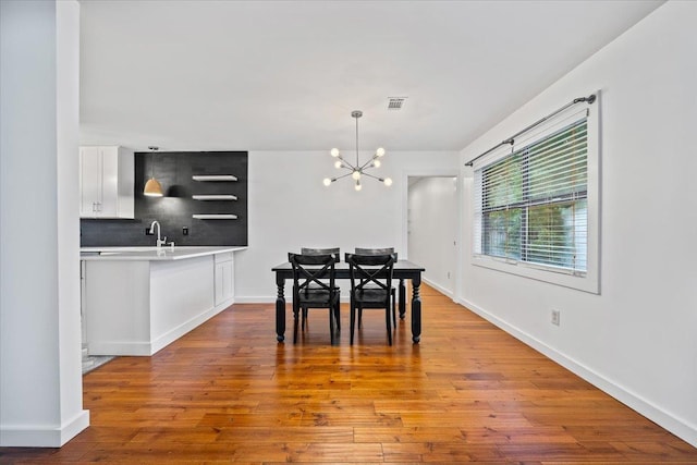 366 Casca Cv, Collierville, TN 38017 - dining space featuring a chandelier and wood finished floors
