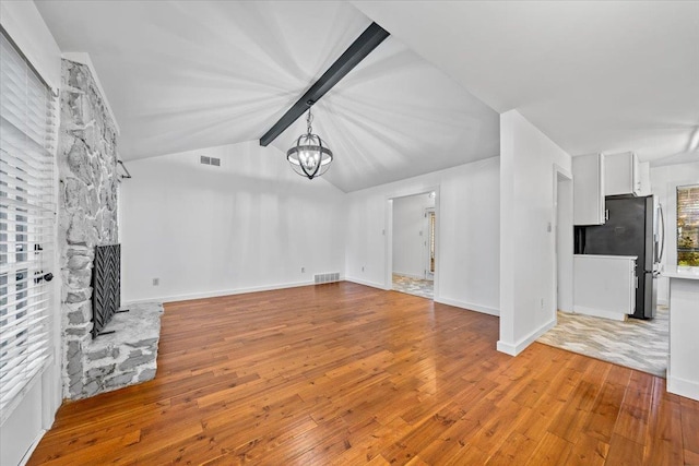 366 Casca Cv, Collierville, TN 38017 - unfurnished living room with a chandelier, hardwood / wood-style floors, and a fireplace