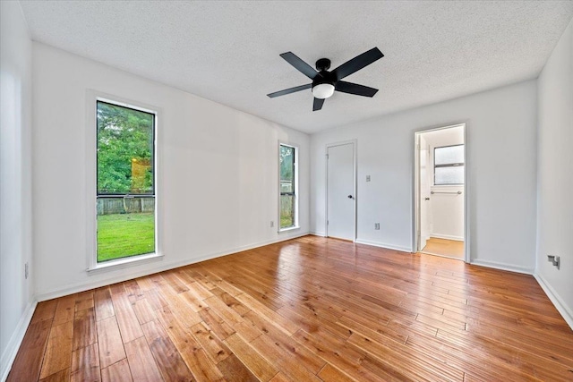 366 Casca Cv, Collierville, TN 38017 - unfurnished bedroom with hardwood / wood-style flooring, a textured ceiling, ensuite bathroom, and a ceiling fan