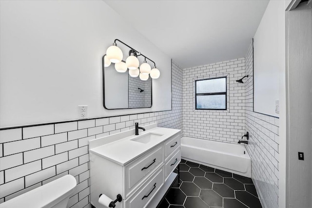 366 Casca Cv, Collierville, TN 38017 - bathroom featuring tile walls, tile patterned flooring, vanity, and shower / tub combination
