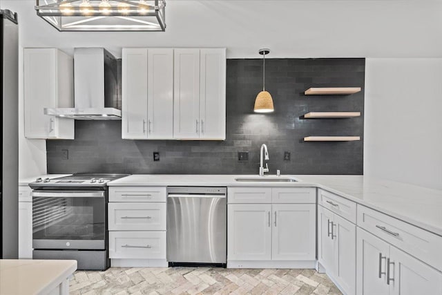 366 Casca Cv, Collierville, TN 38017 - kitchen with stainless steel appliances, wall chimney exhaust hood, open shelves, white cabinets, and tasteful backsplash