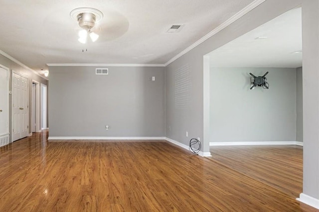 2826 Whitney Ave, Memphis, TN 38127 - unfurnished room featuring ornamental molding, ceiling fan, and wood finished floors