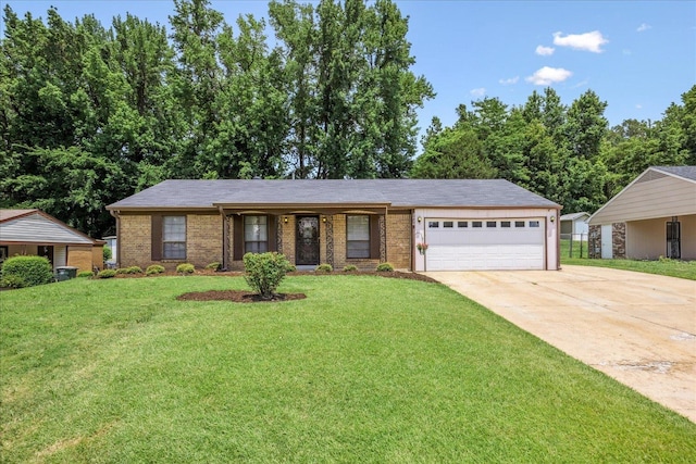 2826 Whitney Ave, Memphis, TN 38127 - ranch-style home featuring brick siding, a garage, driveway, and a front yard