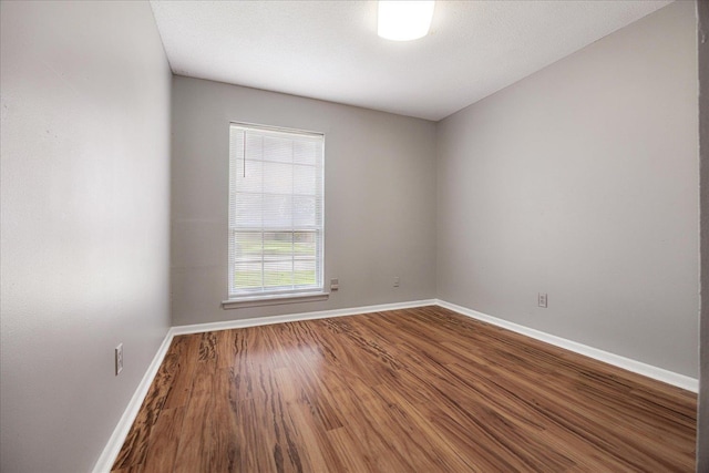 2826 Whitney Ave, Memphis, TN 38127 - spare room with baseboards and wood finished floors