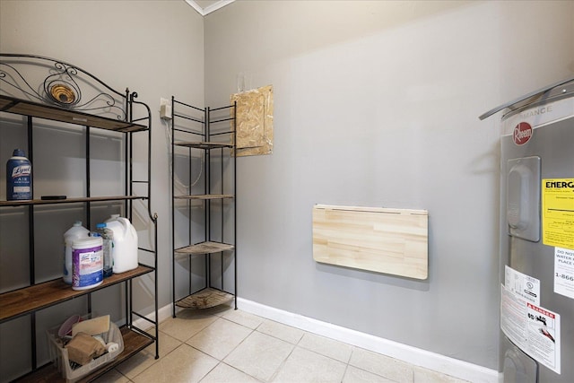 2826 Whitney Ave, Memphis, TN 38127 - tiled bedroom featuring electric water heater and baseboards