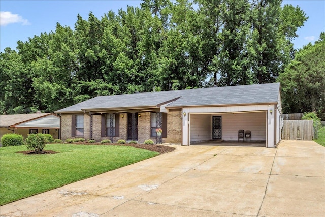 2826 Whitney Ave, Memphis, TN 38127 - view of front of property with driveway, brick siding, covered porch, and a garage